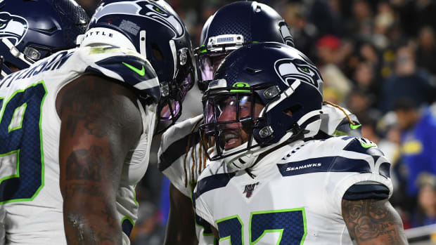Seattle Seahawks defensive back Quandre Diggs (37) celebrates returning an interception for a touchdown against the Los Angeles Rams in the second half of a NFL game at Los Angeles Memorial Coliseum.